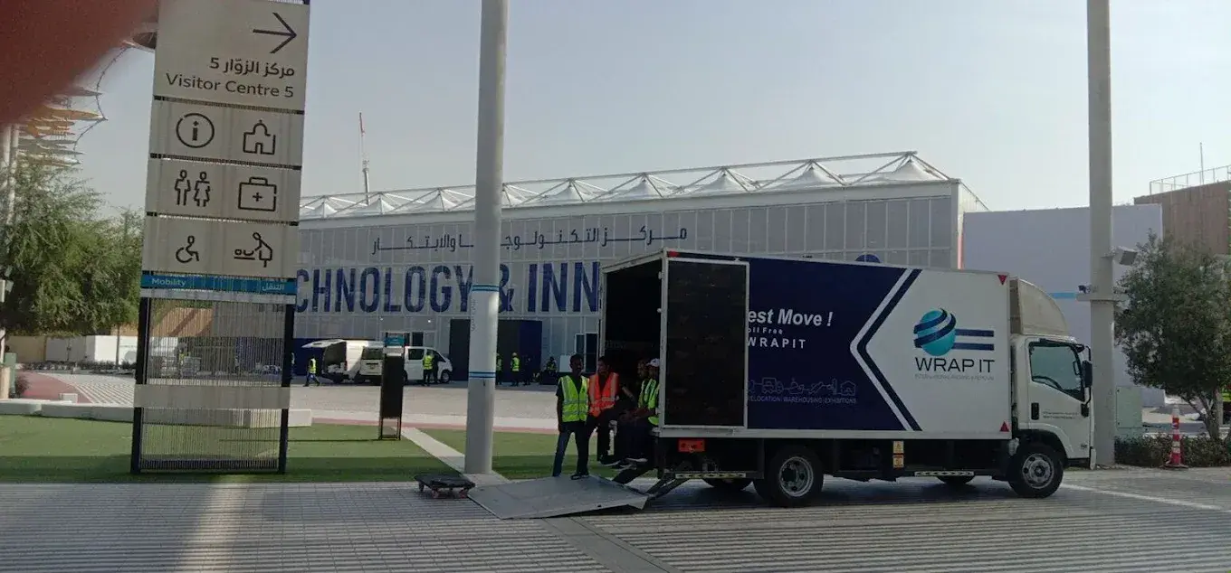 Wrap It crew loading a branded Wrap It truck